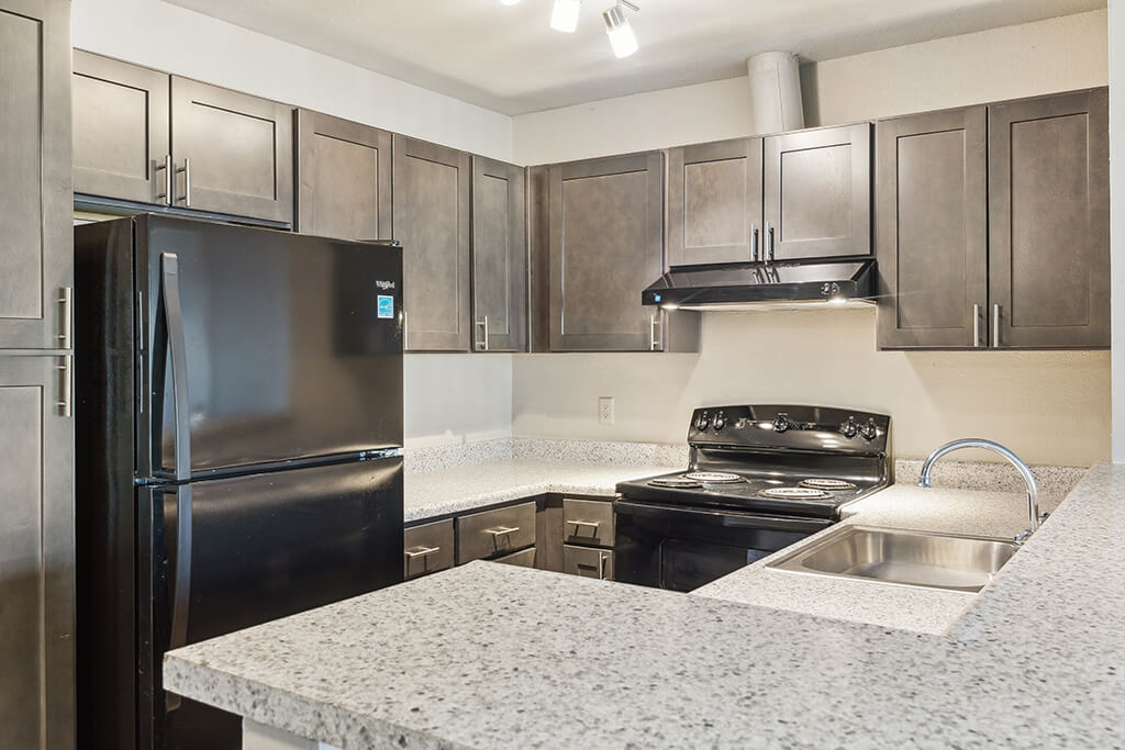 A bright, spacious kitchen at the Woodcreek Apartments in Las Vegas, Nevada.